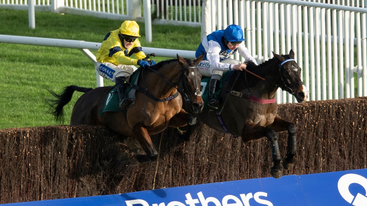 Sky Pirate (left) under Tom Scudamore beats Ibleo under Charlie Deutsch in the Spreadex Handicap Chase